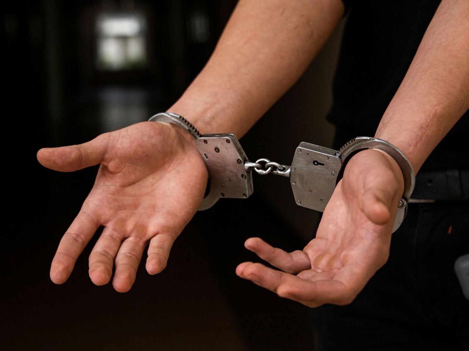 Handcuffs in hands
